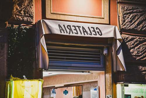 awning white and black Gelateria signage canopy